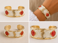 BRAZALETE ACERO DORADO CONCHA ROJA